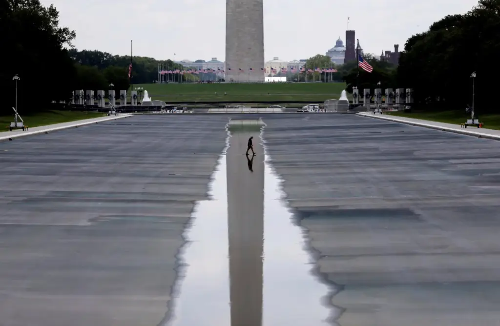 The Washington Monument is seen in the background of the...