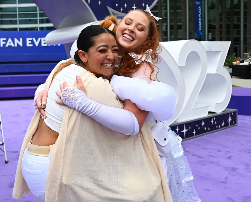 Ingrid Djouzaie, dressed as Padme, left, hugs Amanda Batts, dressed...