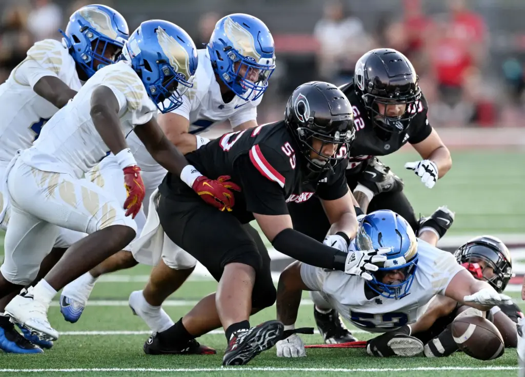 Santa Margaritaâs Isaia Vandermade (53) forces and recovers the fumble...