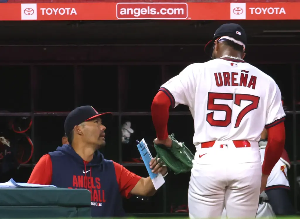 Angels manager Kurt Suzuki, left, celebrates the end of the...