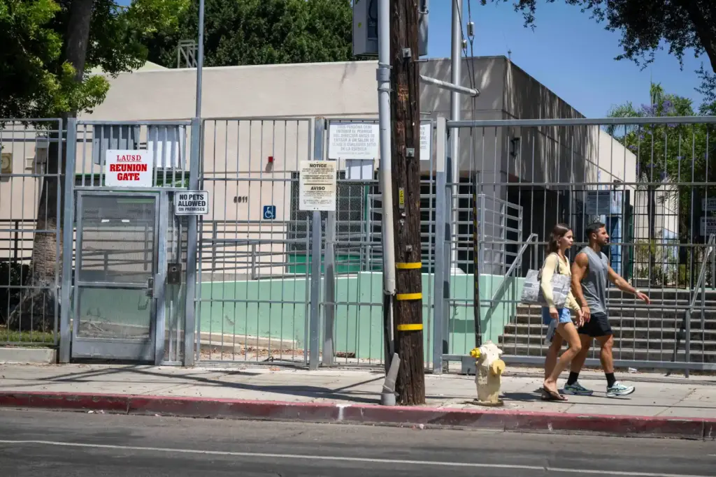 People walk past LAUSDâs Selma Elementary campus in Hollywood on...