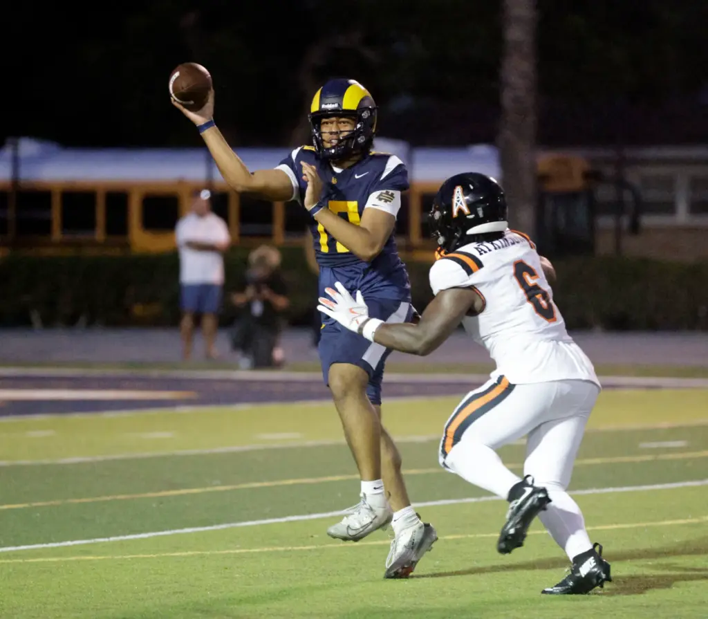 Huntington Beachs Xavier Atkinson (6) looks to stop Millikans Jonah...