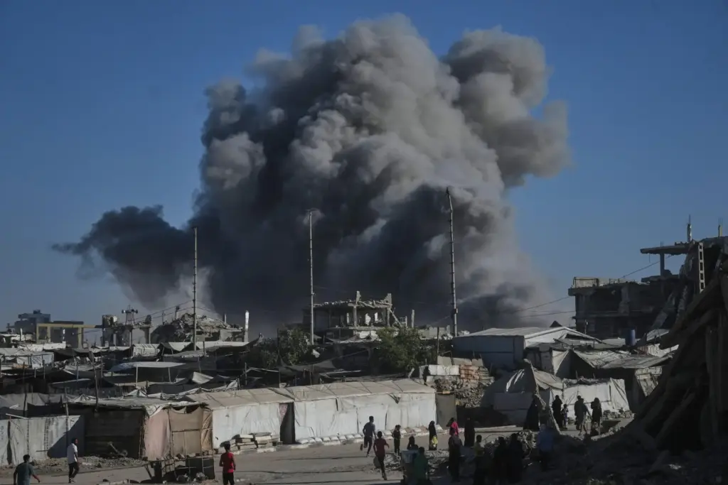 Smoke rises following an Israeli military strike in Gaza City,...
