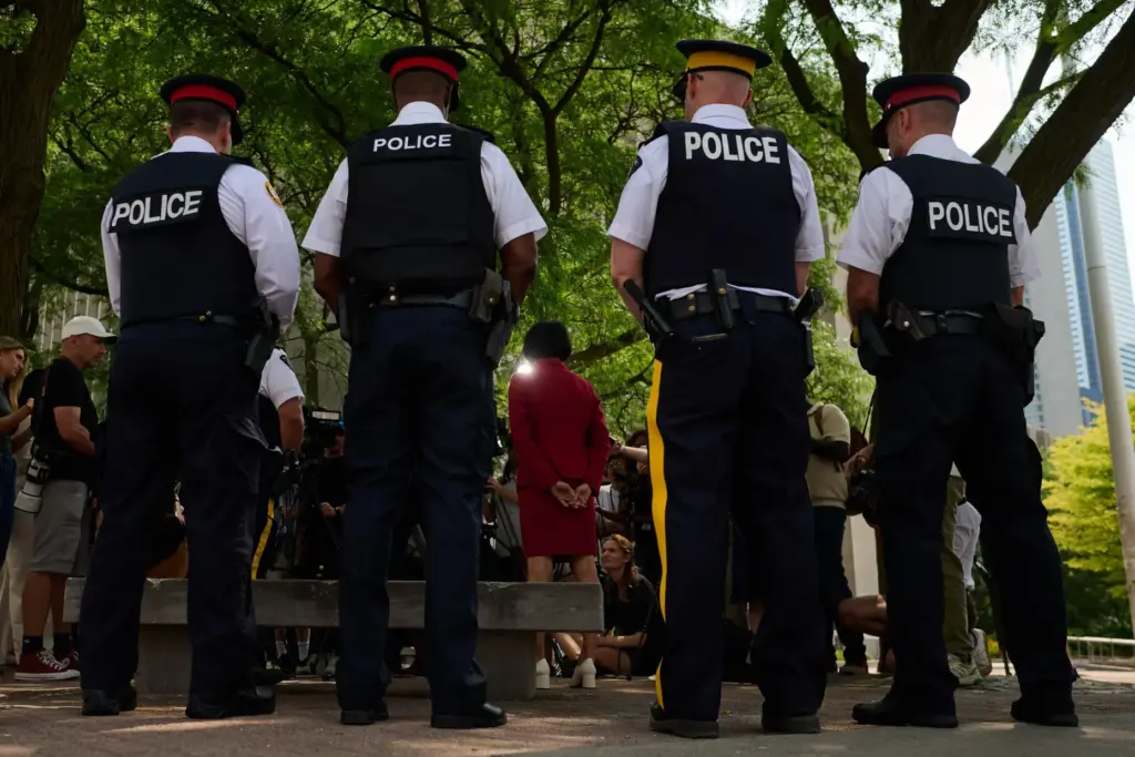 Toronto Mayor Olivia Chow is joined by police as she...