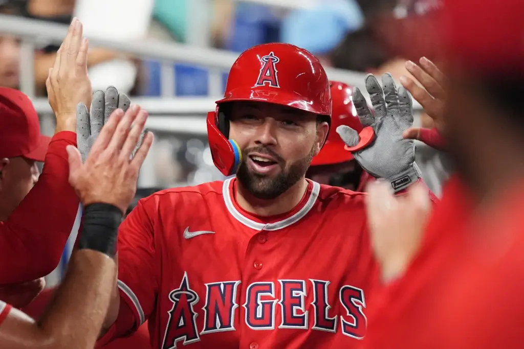 The Angels’ Nolan Schanuel celebrates with teammates in the dugout...