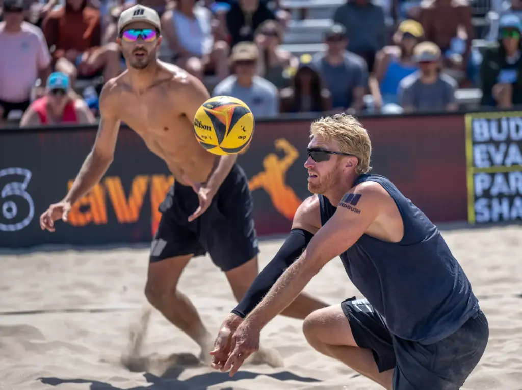 Chase Budinger digs the ball, while playing with teammate Miles...