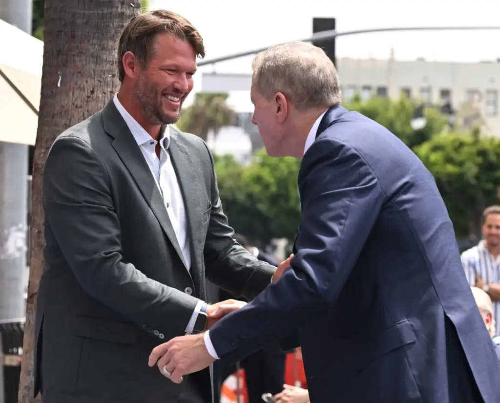 Former Los Angeles Dodgers pitcher, Clayton Kershaw shakes hands with...