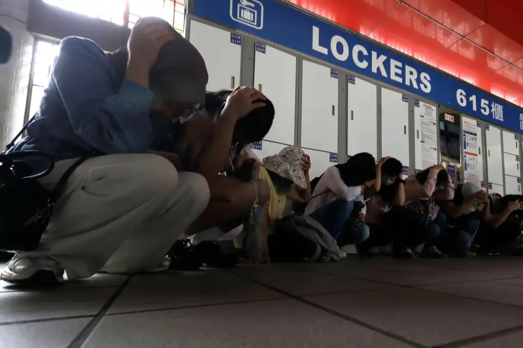 People take cover inside at a MRT station during the Urban Resilience Exercise in Taiwan.