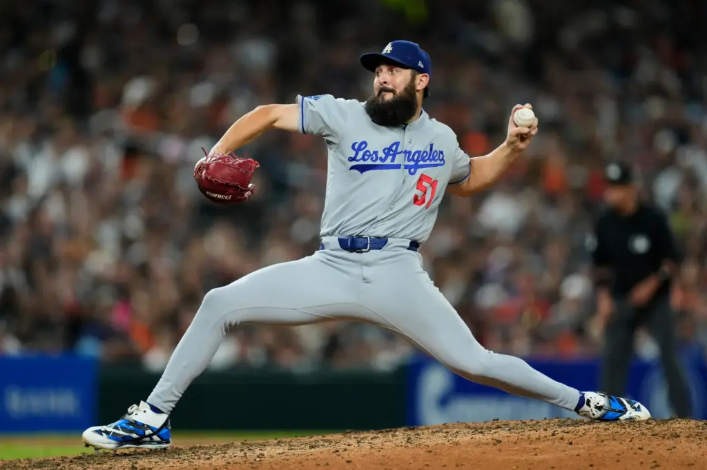 Dodgers relief pitcher Alex Vesia throws to the plate against...