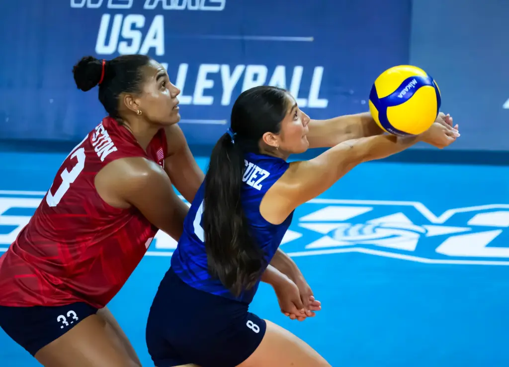 Team USAâs Lexi Rodriguez, right, steps in front of teammate...
