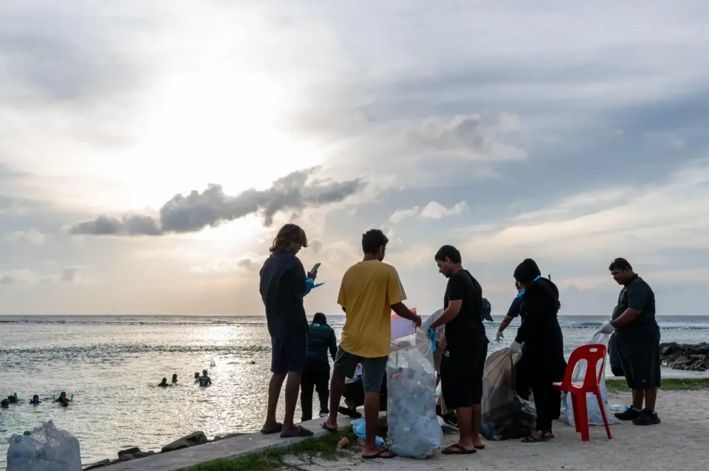 Ripple, a youth group, joins an early morning beach clean...