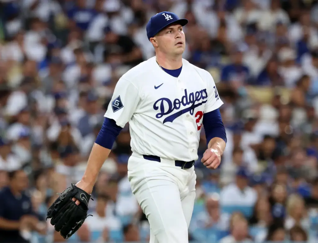 Dodgers starting pitcher Tarik Skubal walks off the field after...