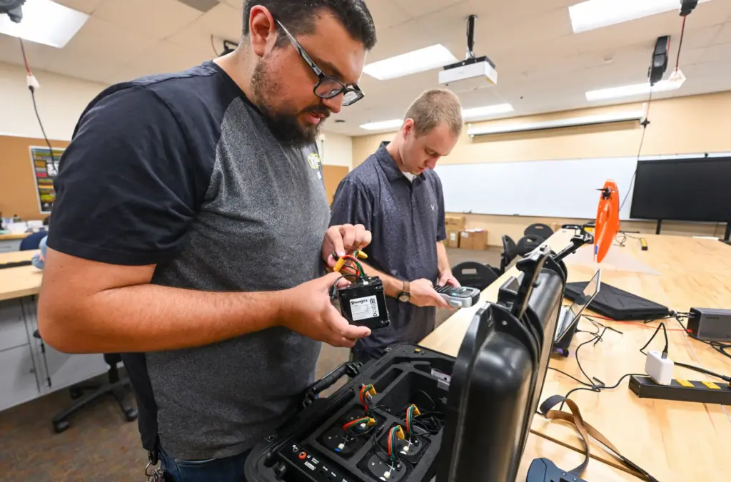 Matthew Alayoubi, left, and Nicholas Stafford inventory equipment at the...