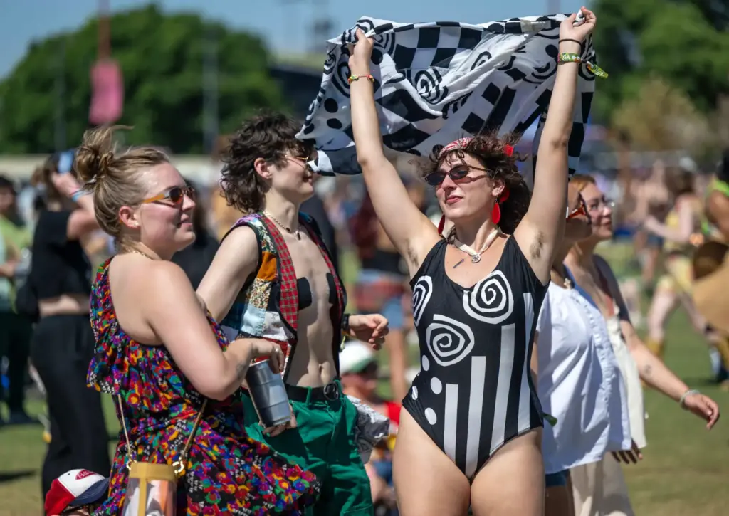 Friends dance together while Mitski performs on the Dandelion Stage...