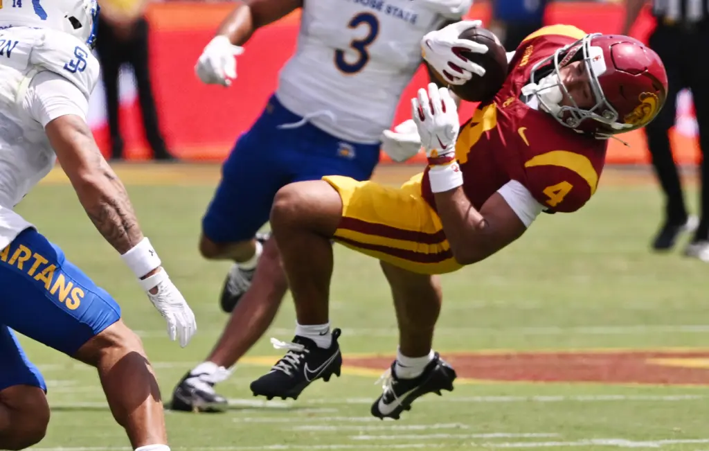 Wide receiver Trent Mosley (4) of the USC Trojans catches...