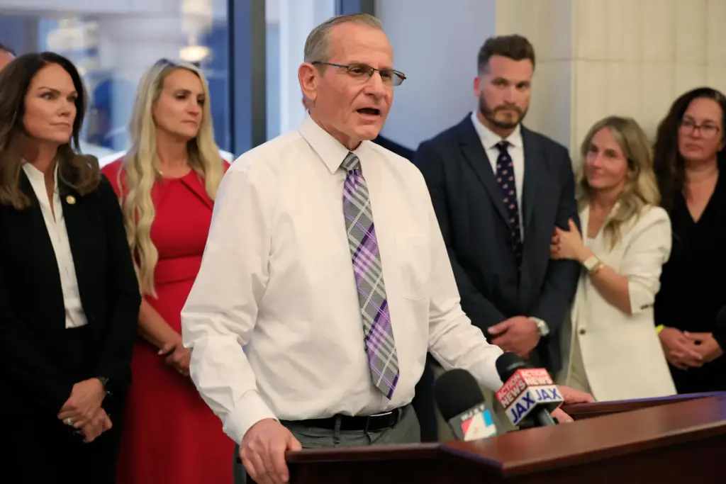 Gaylord Bridegan, father of Jared Bridegan, speaks to members of...