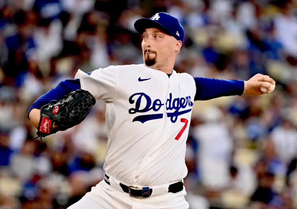 Dodgers starting pitcher Blake Snell throws to the plate during...