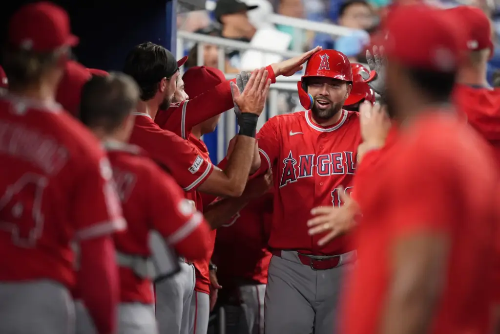 The Angels’ Nolan Schanuel celebrates with teammates in the dugout...