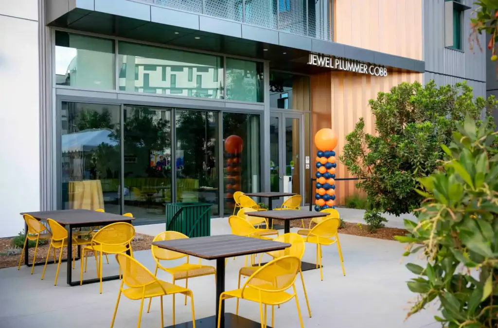 Tables and seating for students sits outside the entrance of...