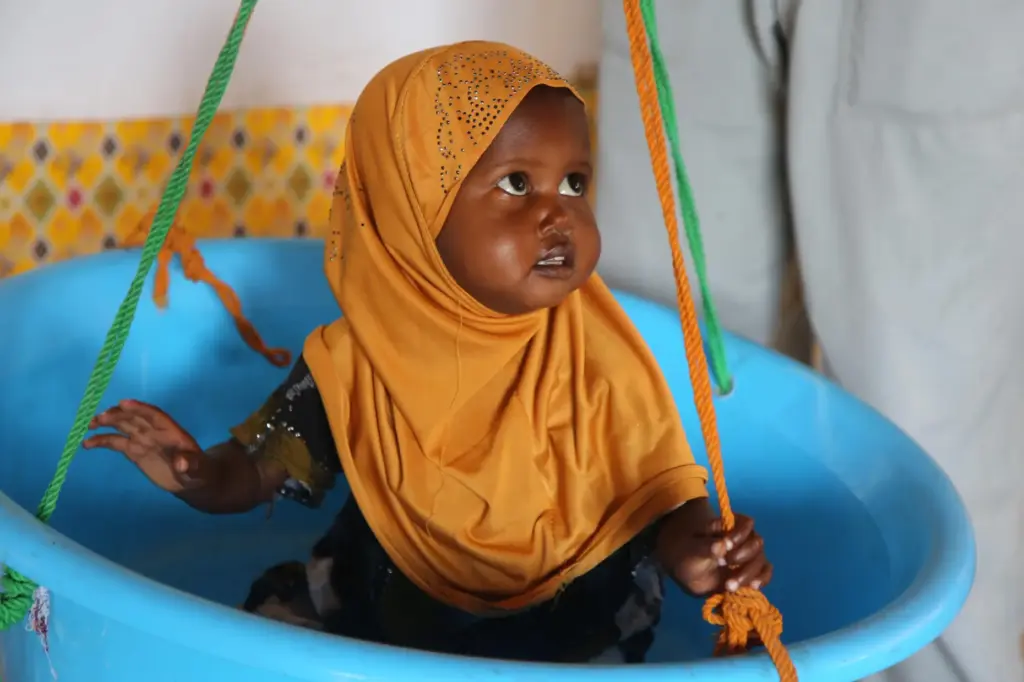 A child is weighed at Feynuus Nutrition Centre on the...