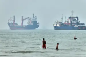 Cargo ship reports being struck in Strait of Hormuz as US, Iran claims about talks diverge