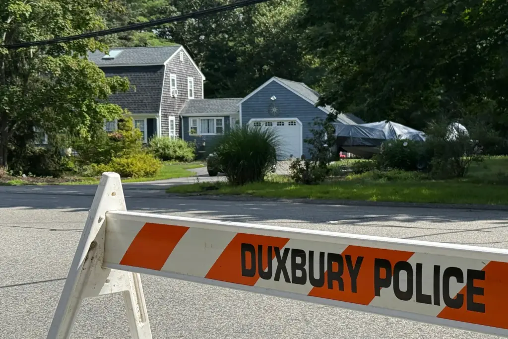 A police barricade stands outside the former home of Lindsay Clancy.