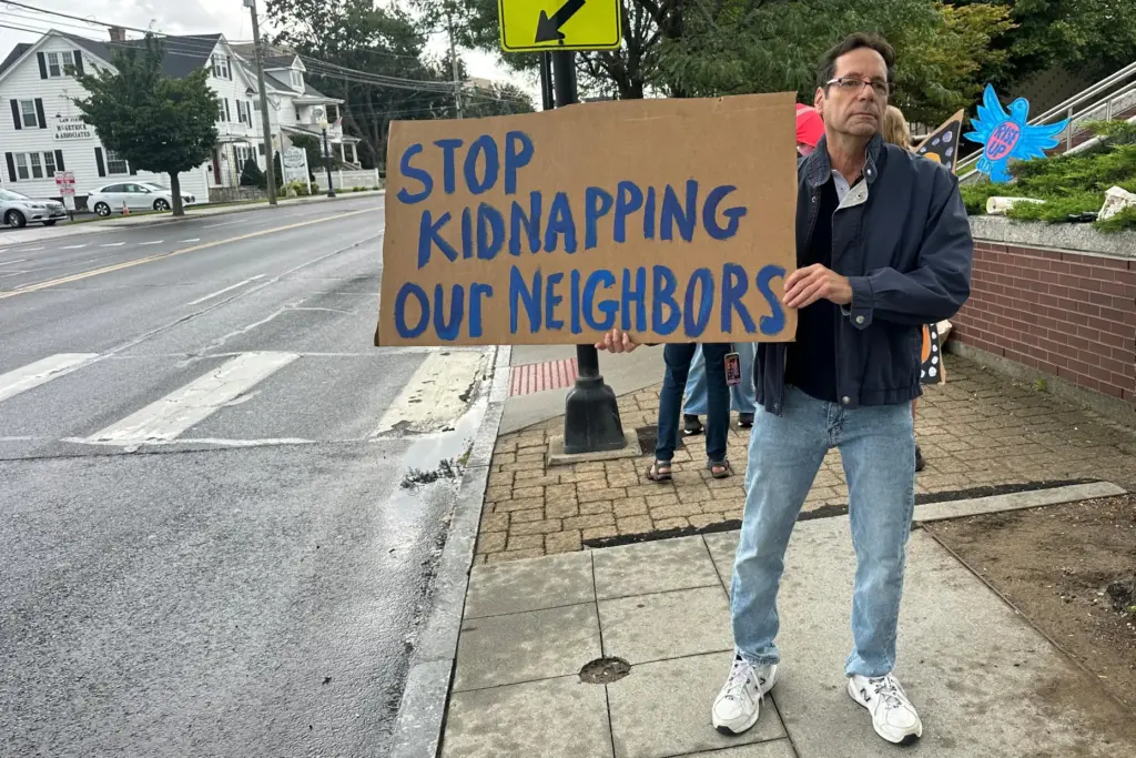 Anti-ICE activists gather outside a courthouse in Danbury, Conn., Thursday,...