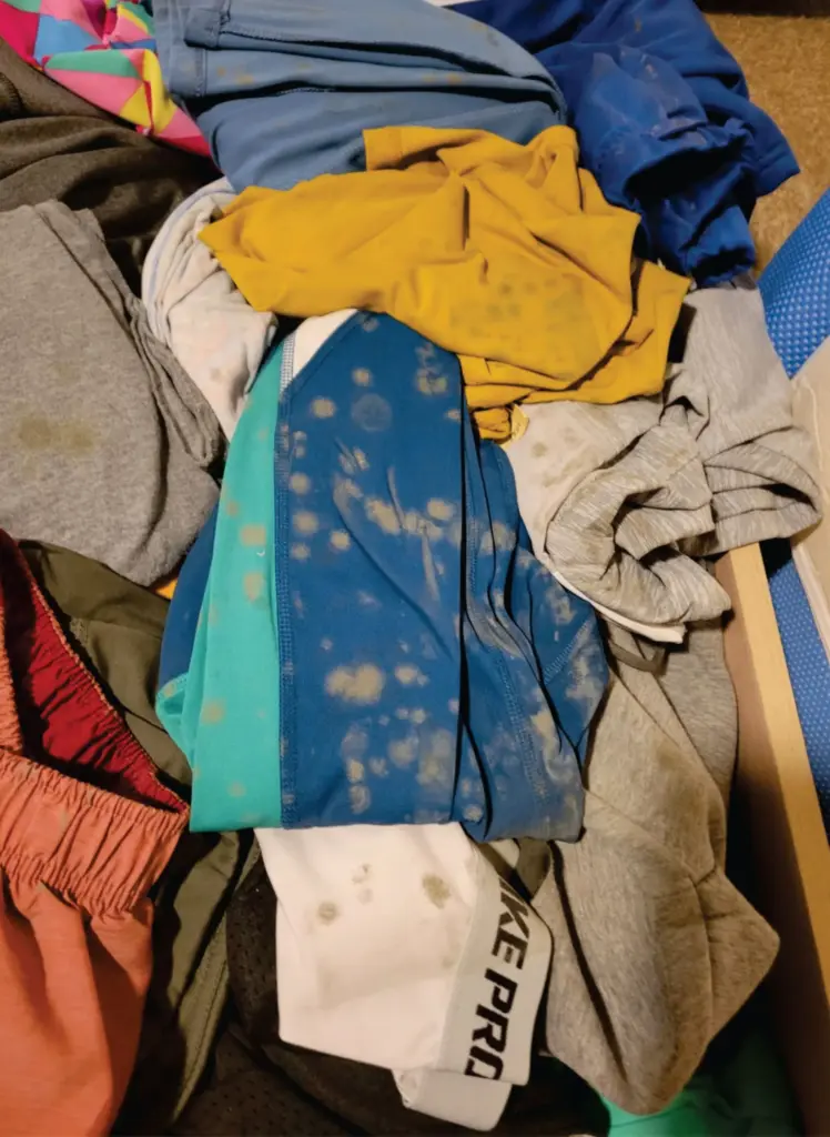Spots of mold speckle articles of clothing.