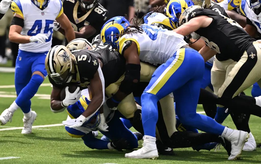 New Orleans Saints running back Kendre Miller (5) runs for...