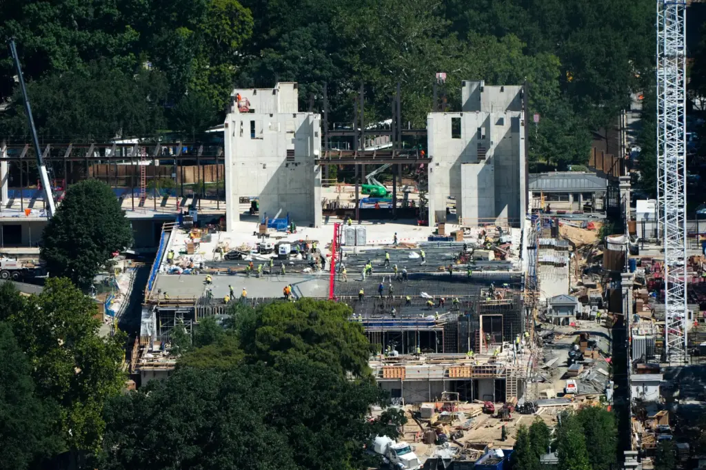 Workers continue construction on the new White House ballroom, as...