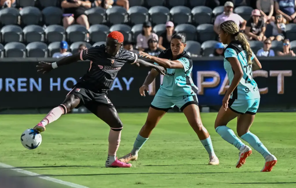 Angel City FC forward Prisca Chilufya (24) keeps the ball...