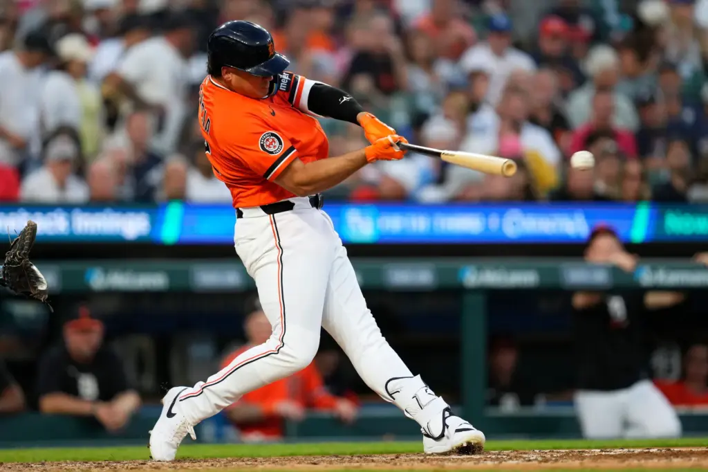 The Detroit Tigers’ Eduardo Valencia hits a double against the...