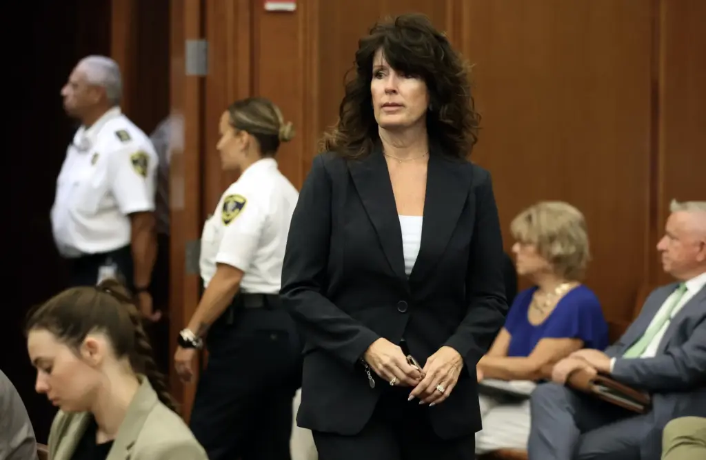 Elaine Rossi, the nanny to Clancy children, enters the courtroom...