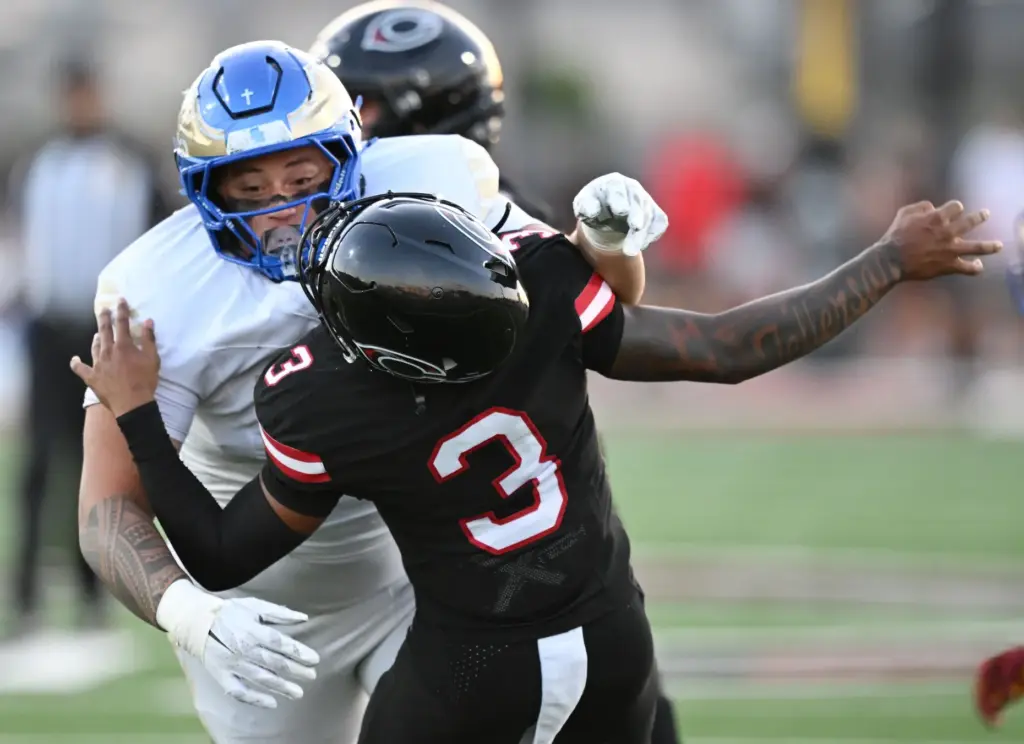 Santa Margarita linebacker Joey Mamola (59) hits Centennial quarterback Jaden...