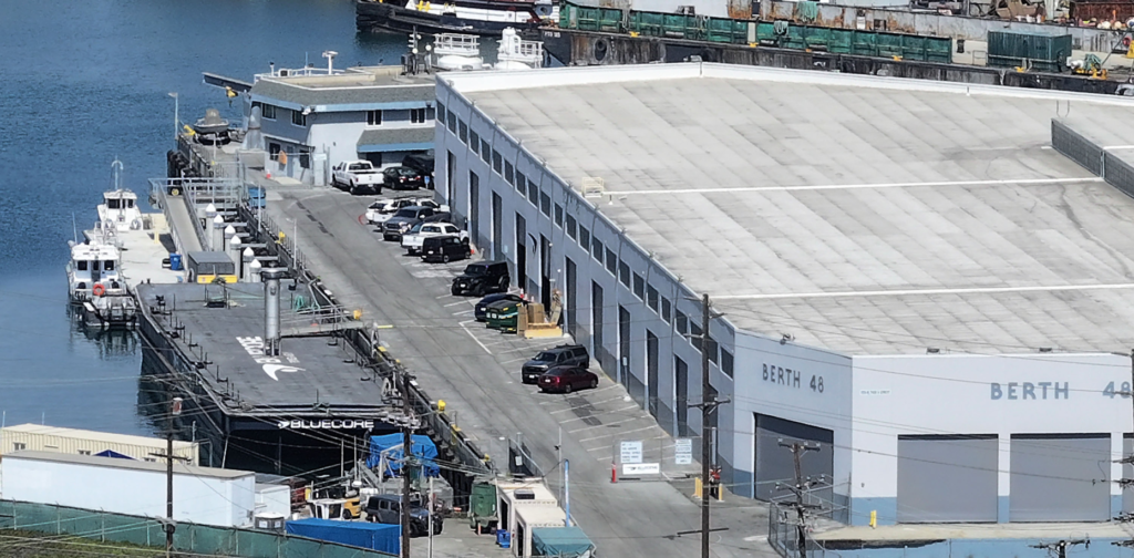 A barge sits at Berth 48 at Bluecore Energy, headquartered...
