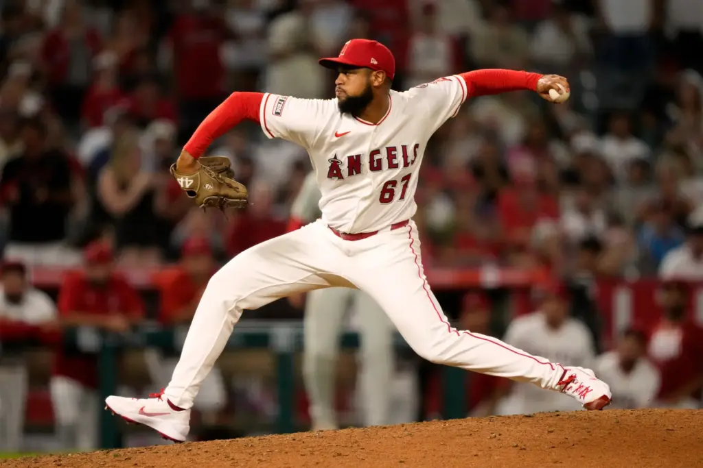 Angels relief pitcher Sammy Peralta throws to the plate during...