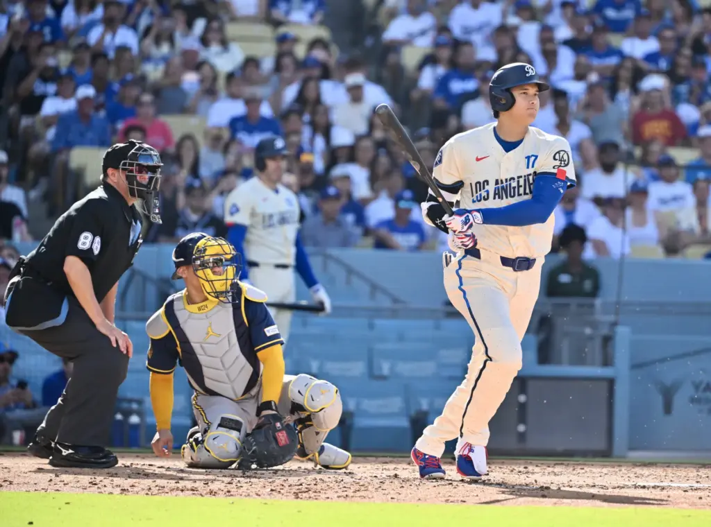 Shohei Ohtani of the Dodgers hits a RBI triple against...