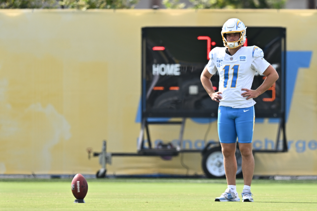 Chargers kicker Cameron Dicker works on kickoffs during a training...