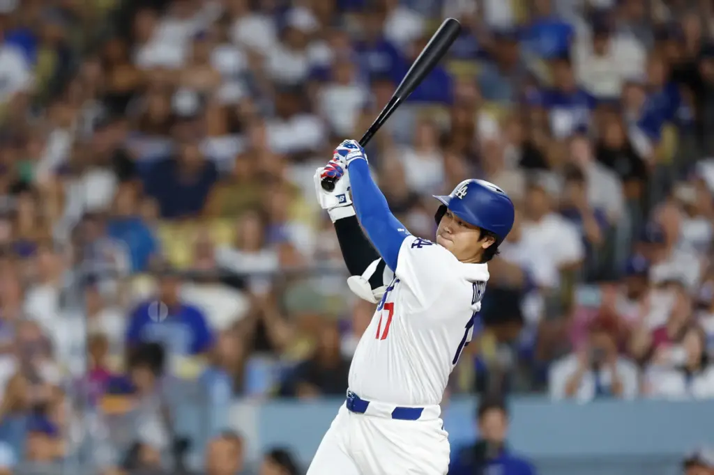 Dodgers star Shohei Ohtani hits an RBI double during the...