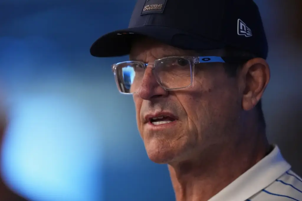 Chargers head coach Jim Harbaugh speaks at a news conference...