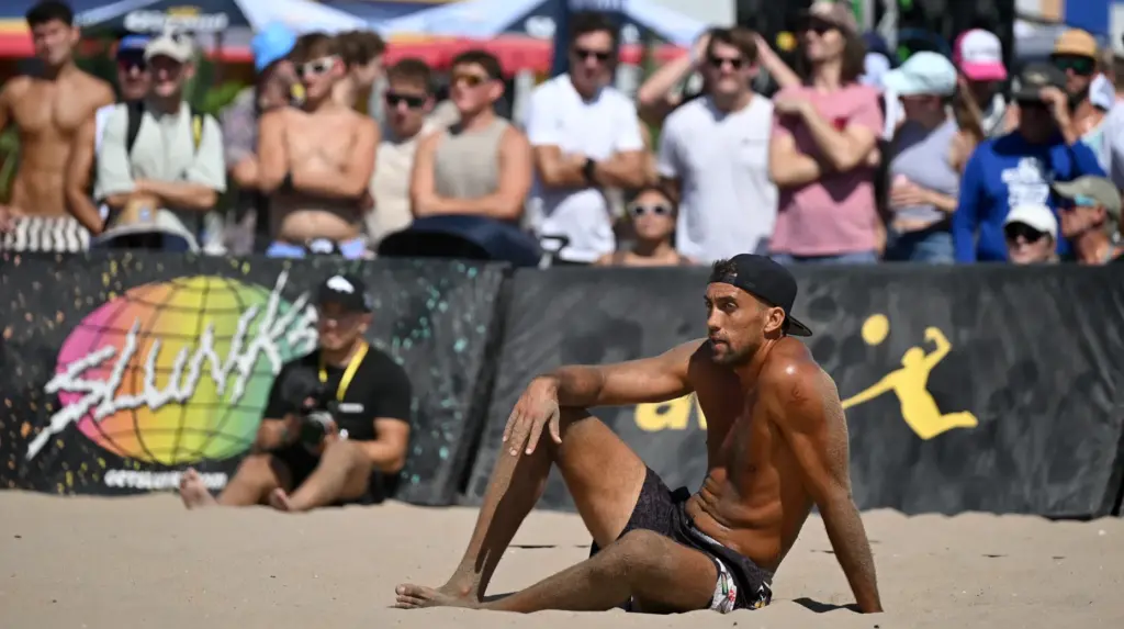 Trevor Crabb sits in the sand after a lost point...