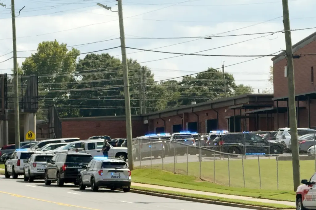 Law enforcement responds to a school shooting at Warner Robins...