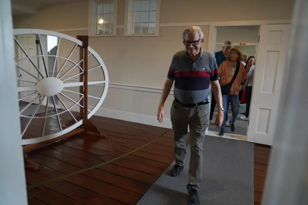 Visitors from around the country tour the third floor of...