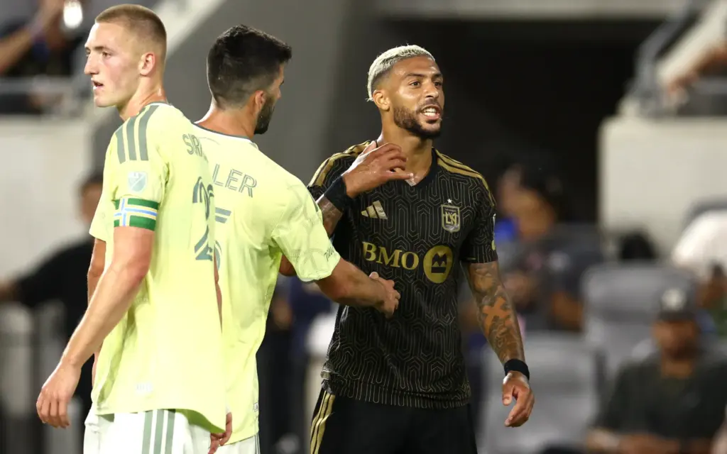LAFC forward Denis Bouanga, right, argues with the referee after...