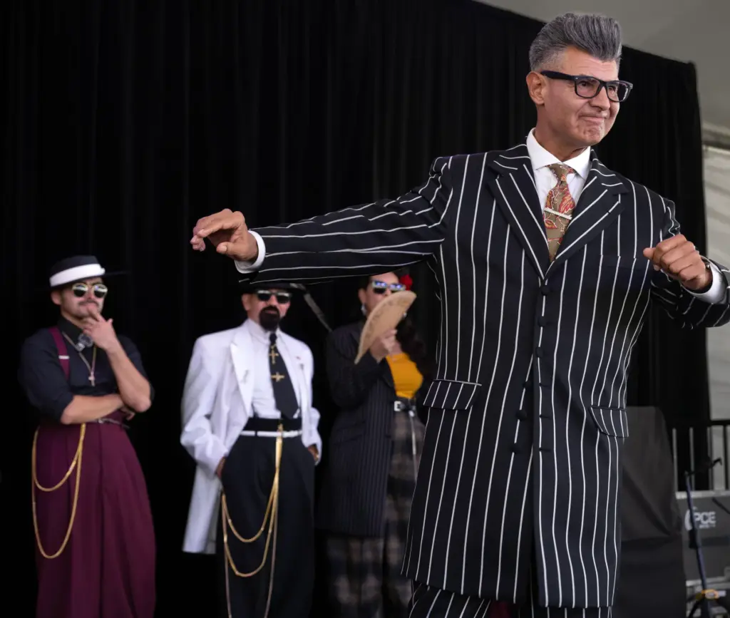 Long vertical lines accentuate Anthony Garcia’s zoot suit, which he...