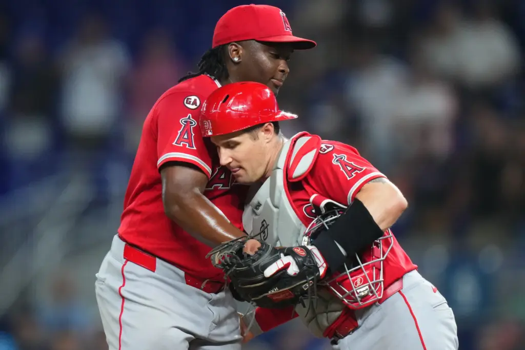 Angels relief pitcher JosÃ© Fermin, left, and catcher Tyler Heineman...