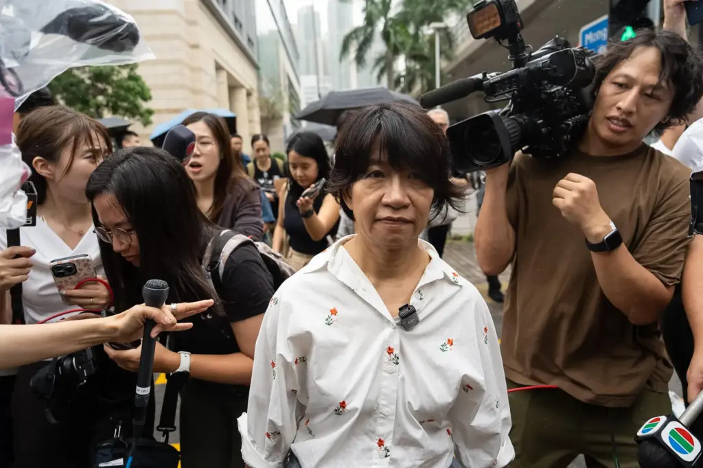 Elizabeth Tang, wife of pro-democracy activist Lee Cheuk-yan, leaves West...