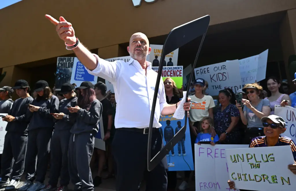 California gubernatorial candidate Steve Hilton holds an outline of a...