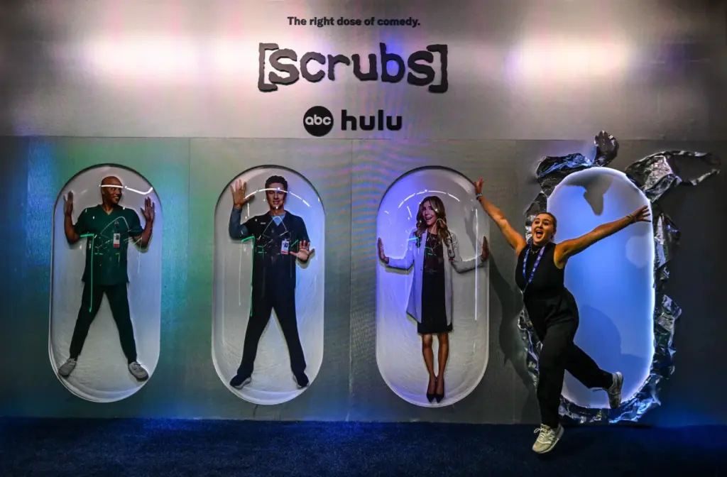 Carly Caramanna takes a picture in the Scrubs display at...