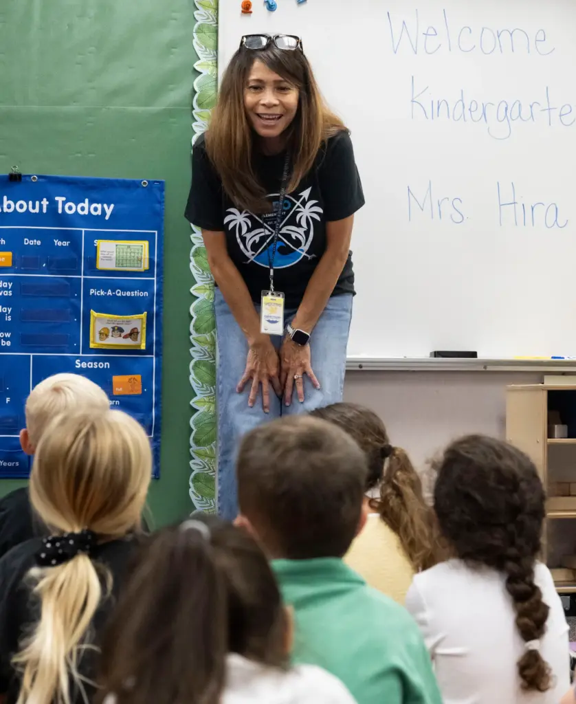 Kindergarten teacher Melissa Hira talks to her class during the...